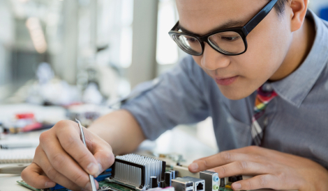 boy working with robotics